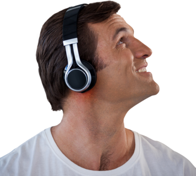 Close-up of mature man wearing headphones looking up