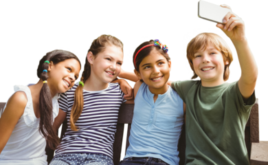 Happy children taking selfie at park