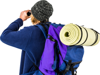 Backpacker looking through his binoculars