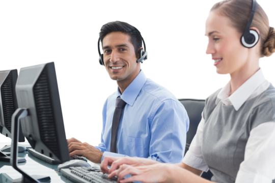 Business people with headsets using computers 
