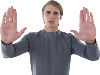 Portrait of young businessman gesturing against white background