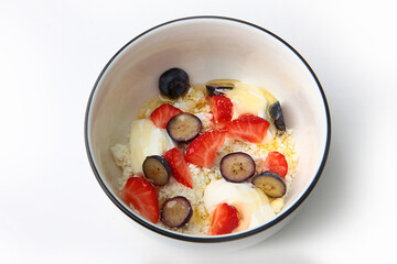 Cottage cheese with strawberry and blueberry, fresh berries, healthy breakfast concept. Top view.Copy space.Isolated object.