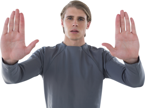 Portrait of young businessman gesturing against white background