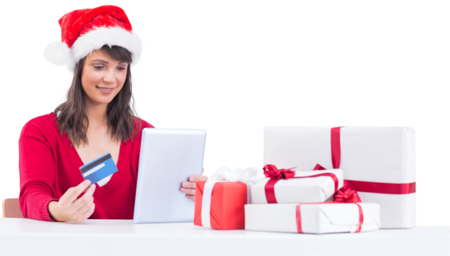 Festive brunette shopping online with tablet pc