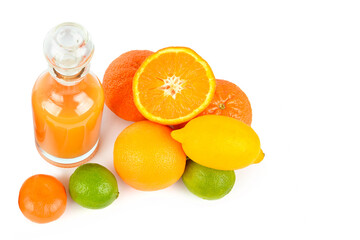 Set of citrus fruits and fruit juice in bottle isolated on white .