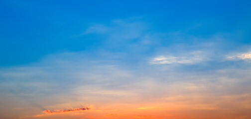 Bright sunrise on blue sky. Wide photo.
