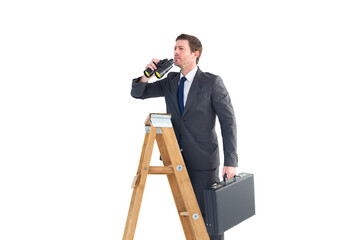 Businessman looking on a ladder