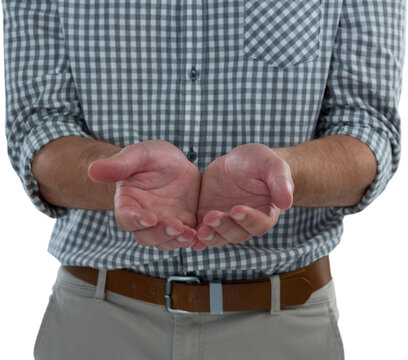 Man with cupped hands against white background