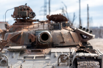 Fototapeta na wymiar damaged military tank on a city street in Ukraine