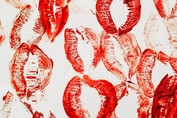 Lip prints of cosmetic lipstick on a light background.