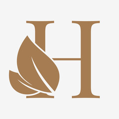 letter H with leaf decoration initial luxury vector logo design
