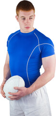 Serious rugby player holding rugby ball