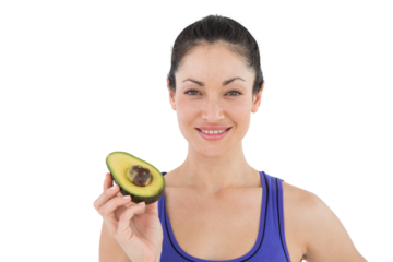 Pretty woman showing half of an avocado