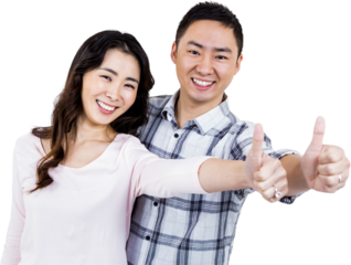 Couple showing thumbs up while standing 