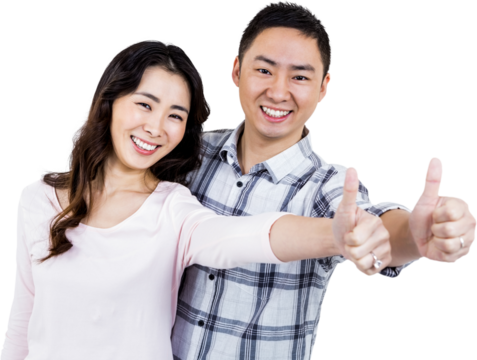 Couple showing thumbs up while standing 