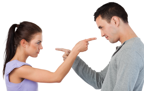 Young couple pointing at each other