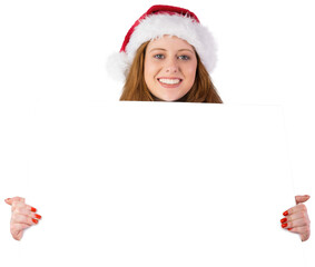 Festive redhead smiling at camera holding poster