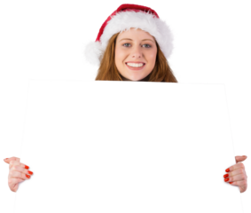 Festive redhead smiling at camera holding poster