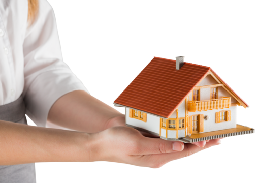 Businesswoman holding model house - Powered by Adobe