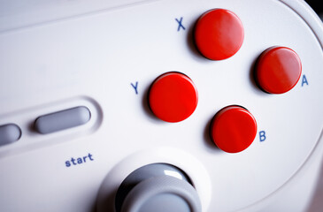 Classic gamepad red buttons in detail background