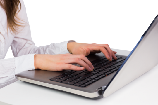 Woman typing on her laptop