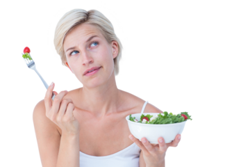 Thoughtful blonde eating salad