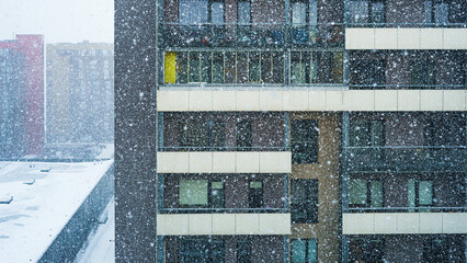 start of heavy blizzard in an residential area in a city