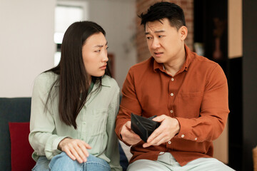 Asian married couple, wife and husband, confused by empty wallet, the calculation of expenses, do not have money
