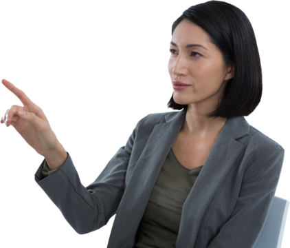 Businesswoman touching invisible screen
