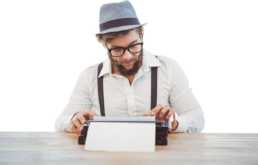 Hipster wearing eye glasses and hat working on typewriter