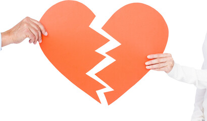 Couple holding broken heart shape paper