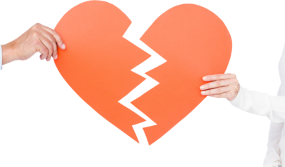 Couple holding broken heart shape paper