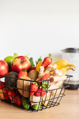 Healthy fresh fruit and vegetable and blender  for smoothies with assorted ingredients of various colors and tastes. Superfood detox and diet food concept