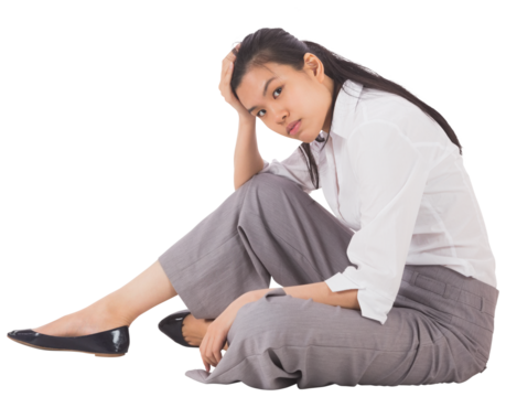 Depressed businesswoman sitting with hand on head