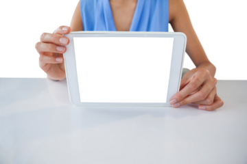 Mid section of businesswoman holding digital table at table