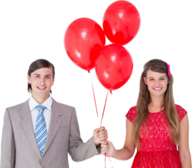 Smiling geeky couple holding red balloons