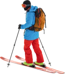 Foto auf Acrylglas Wintersport Skier with yellow backpack skiing 