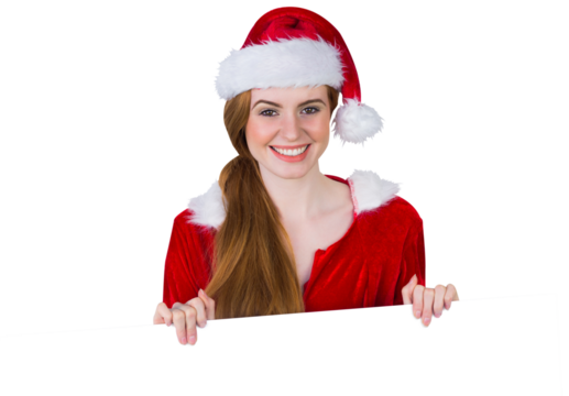 Pretty girl in santa costume showing card