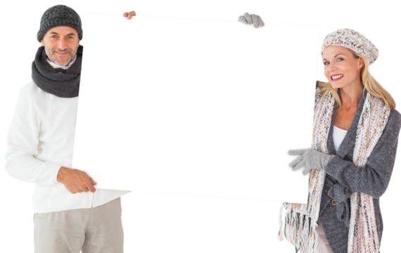 Smiling couple in winter fashion holding poster - Powered by Adobe