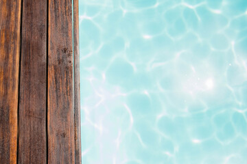 Wood pier by swimming pool