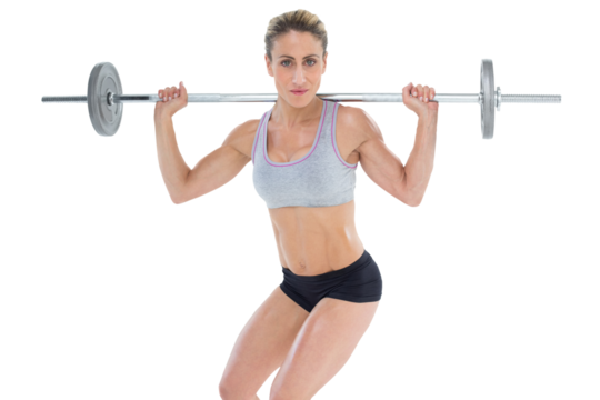 Strong female crossfitter lifting barbell behind head looking at camera - Powered by Adobe