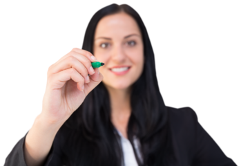Pretty businesswoman writing with marker