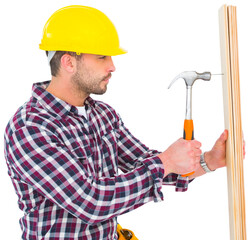 Handyman using hammer on wood 