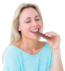 Foto op Plexiglas Pretty blonde enjoying and eating bar of chocolate  © vectorfusionart