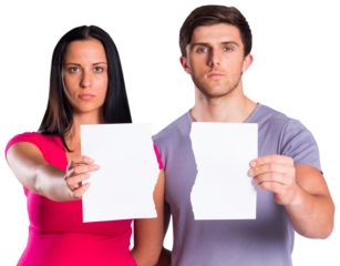 Couple showing broken piece of paper