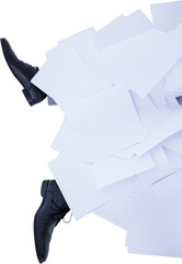 Low section of businessman covered with documents
