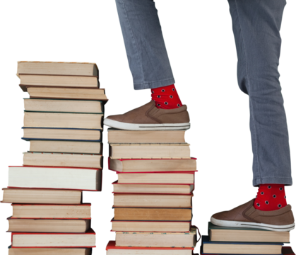 Low section of boy climbing stack of books - Powered by Adobe