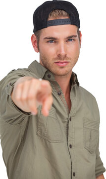 Man wearing baseball hat backwards and pointing