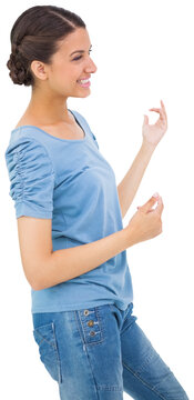 Pretty brunette playing air guitar