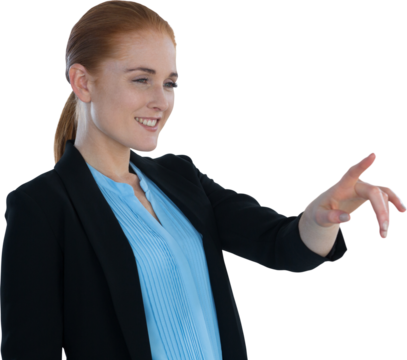 Smiling young businesswoman touching imaginary interface